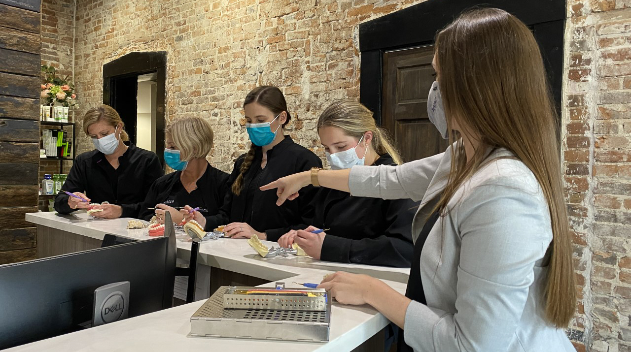 Dental professionals experiencing in-office CE with Young Innovations